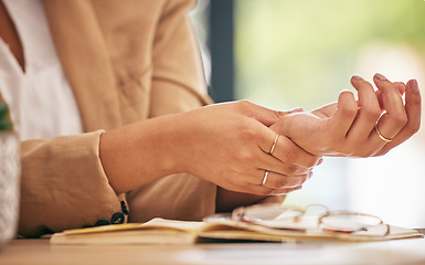 Image showing Hands, business woman and pain in wrist from osteoporosis, orthopedic injury or health risk. Closeup of worker, carpal tunnel and muscle problem from joint stress, fibromyalgia or first aid in office