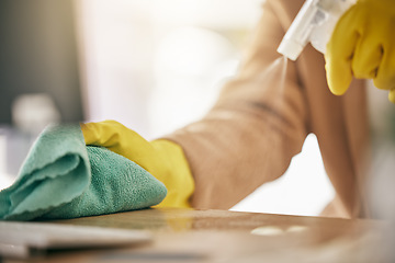 Image showing Person, hands and detergent on table with cloth for hygiene, bacteria or germ removal at home. Closeup of cleaner, housekeeper or maid wiping furniture in domestic service or disinfection on surface