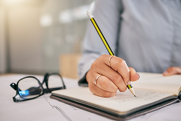 Image showing Hand, book and a architect woman writing a note in her journal, diary or planner to remember an appointment. Planning, schedule and notebook with a female engineer sitting in her office closeup