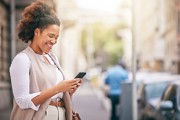 Image showing Phone, city and business woman walking and travel in a town typing on social media, online or internet. Connection, smile and happy African person texting a contact via email, web or mobile app