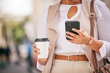 Image showing Phone, coffee and hands of person walking and travel in city typing on social media, online or internet. Connection, gps and employee texting a contact via email, web or mobile app in the morning