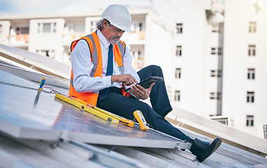 Image showing Tablet, solar panels and engineering man in city, rooftop and urban development, sustainability or energy saving installation. Digital technology, inspection and electrician or person with power grid