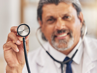 Image showing Man, portrait and a doctor with a stethoscope for healthcare, consultation or medical test. Happy, hospital and a mature male nurse or surgeon with gear for a clinic, cardiology or nursing exam