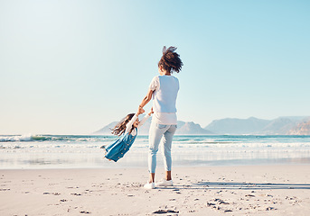 Image showing Mother, spin and a child happy at the beach while on a family vacation, holiday or adventure. A young woman or mom and girl kid playing together while outdoor for summer fun and travel in nature