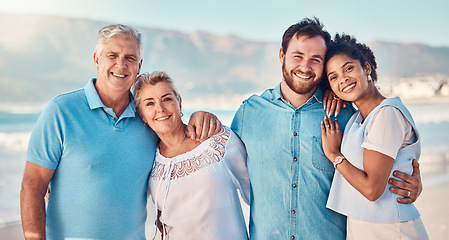 Image showing Portrait, diversity and love with a blended family on the beach together in summer for vacation or holiday. Senior parents, smile and in laws with a group of people standing y by the ocean or sea