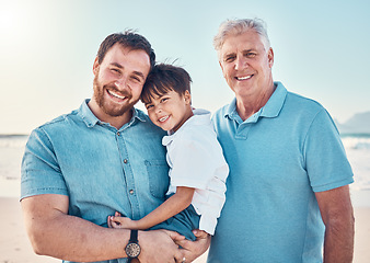 Image showing Father, grandfather and a child happy at the beach while on a family vacation, holiday or adventure. A senior man, dad and boy kid together while outdoor for summer fun, portrait and travel by sea