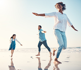 Image showing Mother, father and daughter on the beach to dance together while outdoor for travel or vacation in summer. Sunset, family or children and a girl having fun with her parents on the coast by the ocean