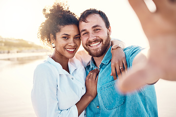 Image showing Selfie, smile and happy couple on beach for holiday to celebrate love, marriage and memory on social media. Digital photography, man and woman relax on ocean vacation together in summer with nature.