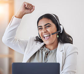 Image showing Excited, success and a woman in a call center with a laptop for telemarketing, sales goal and target. Happy, celebrate and a young customer service employee with a smile for a consulting achievement