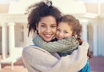 Image showing Portrait, happy mother and girl in backyard, hug and bonding together by home. Face, kid and multiracial African mom with foster child, love and care with a smile for quality time outdoor by house