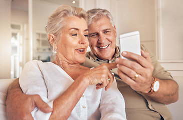 Image showing Home, smile and senior couple with a smartphone, love and quality time with social media, chatting and sms. Cellphone, old man and elderly woman with happiness, mobile app and relax with connection