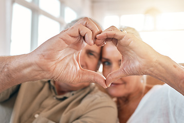 Image showing Senior couple, heart hands and love for support, care or trust in compassion or relationship at home. Closeup of elderly man and woman touching hand together for loving emoji, symbol or sign in house