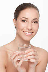 Image showing Hydration is key. A beautiful woman with bare shoulders holding a glass of water.