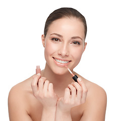 Image showing Makeup, beauty and lipstick on the face of a woman, happy with cosmetic product on a png, transparent and mockup or isolated background. Portrait of a beautiful girl doing her lip morning routine