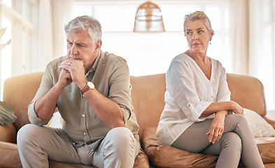 Image showing Senior couple, divorce and disagreement in conflict, fight or argument on living room sofa at home. Elderly woman and frustrated man in depression, cheating affair or toxic relationship in the house