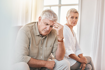 Image showing Senior couple, divorce and headache in conflict, fight or argument on the living room sofa at home. Elderly woman and frustrated man in depression, cheating affair or toxic relationship in the house