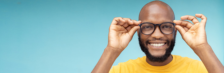 Image showing Black man, portrait or vision glasses on blue background, isolated mockup or wall mock up for eyes care, retail or sales deal. Smile, happy or face and fashion optometry for lens healthcare wellness