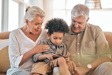 Image showing Phone, grandparents and child in home, happy and bonding together in living room. Smartphone, interracial kid and grandpa and grandma in lounge streaming movie, video or internet film on social media