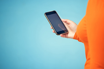 Image showing Hand, mockup screen and woman phone for advertising sale, promotion or brand website on internet. Person with smartphone on blue background studio for about us, communication or network connection