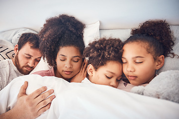 Image showing Family, sleeping and together in bed at home for security, bonding and comfort. Healthy, mixed race and a man, woman and children nap, dream and rest or relax in a bedroom with love, care and peace