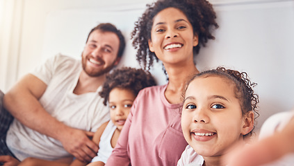 Image showing Happy family, smile and selfie on bed at home for quality time, bonding or morning. Portrait, mixed race and profile picture of a man, woman and children in a bedroom with love, care and comfort