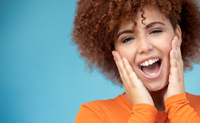 Image showing Surprise, happy and portrait of a woman in a studio with mockup space for sale, deal or discount. Happiness, scream and female model with a excited and shocked facial expression by a blue background.