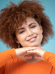 Image showing Beauty, smile and portrait of woman on blue background enjoying calm weekend, freedom and relaxing. Fashion, trendy style and face zoom of happy girl with confidence, positive attitude and cosmetics