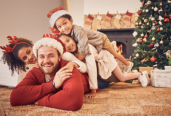 Image showing Christmas, portrait and happy family in home on floor, bonding and together. Xmas, smile and face of parents with children, interracial and African mom with father for party, celebration or holiday