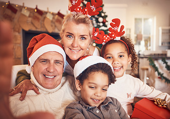 Image showing Christmas, portrait and selfie of grandparents with children in home, bond and happy together. Xmas, face and grandma and grandpa with kids, interracial and profile picture for celebration of holiday