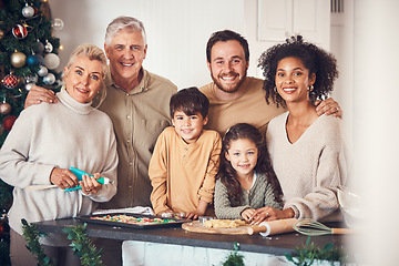 Image showing Christmas, portrait and family cooking cookies in home kitchen, bond and together. Xmas, baking food and happy face of grandparents, children and interracial parents at party, celebration or holiday