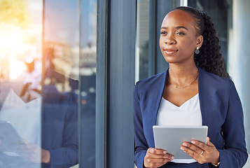 Image showing Office, happy woman with tablet and thinking at window in business, smile and insight for online career. Happiness, digital work and businesswoman with ideas, planning and feedback for internet job.