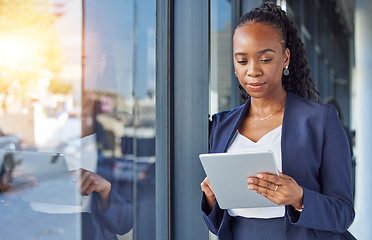 Image showing Business, black woman with internet and tablet at window in office, thinking and ideas in research. Email, digital work and insight, businesswoman and online review planning with feedback for project