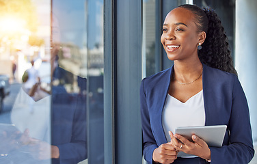 Image showing Business, black woman with smile and tablet at window in office, thinking and ideas for online career. Happiness, digital work and businesswoman with insight for planning feedback for internet job.