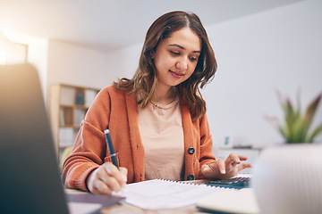 Image showing Remote work from home, woman writing and laptop with finance, budget planning and startup. Female person, entrepreneur or accountant with documents, lounge or check paperwork with focus or connection