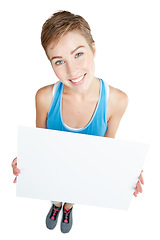 Image showing Announcement, smile and portrait of a woman with a board isolated on a white background in studio. Billboard, branding and girl holding a mockup banner with space for advertising on a backdrop