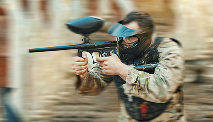 Image showing Paintball gun, gear or man shooting competition, aim and target soldier, warrior or action player in battlefield game arena. Outdoor blur, rifle or male shooter focus on battle, conflict or challenge