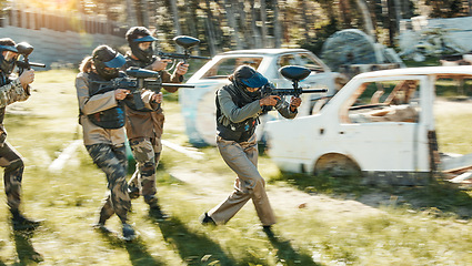 Image showing Teamwork, challenge and paintball with man in game for playground, war and gaming. Sports, mission and soldier with people shooting in battlefield arena for target, gun and warrior training