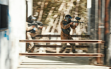 Image showing Paintball, battlefield and team, motion blur and attack with target, soldier with gun and fight. Power, war and action, challenge and war games, military tactics and army teamwork with people outdoor