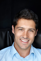 Image showing Hes a gorgeous guy. Cropped portrait of a young man smiling brightly against a black background.