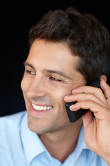 Image showing Her phone calls are the best company. Shot of a handsome young professional talking on his cellphone.