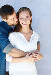 Image showing Dating my best friend. A cropped portrait of a beautiful young girl standing in the arms of her boyfriend.