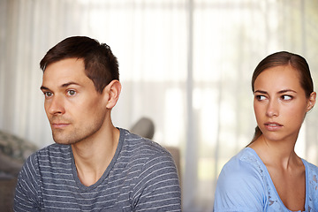 Image showing If he only knew. Shot of a young couple having a disagreement at home.