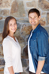 Image showing They make a perfect pair. Portrait of a young couple standing outside.