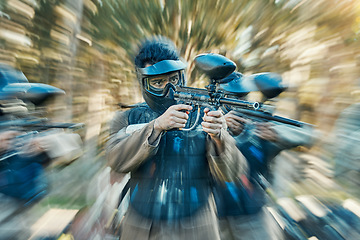 Image showing Paintball, action and team of friends ready for a battle and teamwork, collaboration and shooting game together. Serious, blur and army on a mission on the battlefield with guns for competition