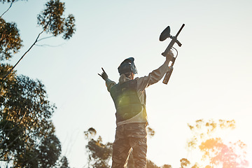 Image showing Paintball game, winning and woman celebrate battlefield success, military training achievement or victory. Army mission, nature sky and back of female winner of competition, war conflict or challenge