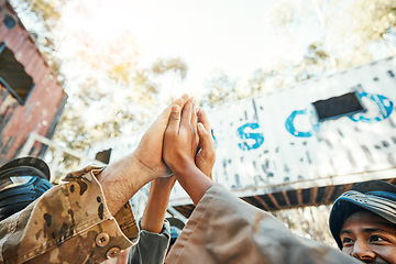 Image showing Paintball, hands and high five for teamwork, support or trust in game plan, collaboration or unity on battle field. Group of paintballers touching hand for team building motivation before match start