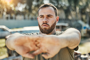 Image showing Focus, stretching and a man in nature for fitness, running idea and thinking of motivation for a workout. Serious, hands and an athlete with a vision for training, exercise or a warm up in a park
