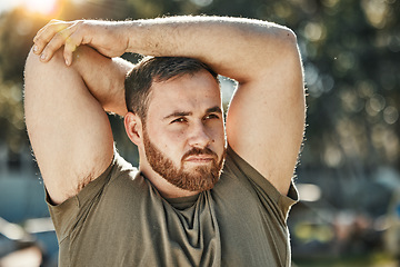 Image showing Outdoor, fitness and man stretching, workout and training with focus, exercise and wellness. Male person, nature or guy with sports, stretch and motivation with health, challenge or muscle with power