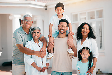 Image showing Happy, smile and portrait of big family outdoor together in the backyard of their modern house. Happiness, excited and children bonding with their grandparents and parents in a garden by their home.