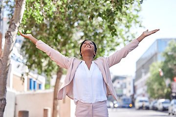 Image showing Freedom, city and businesswoman stretching arms in achievement of success, happiness and motivation. Urban business, power and happy woman in street in winning celebration of promotion, bonus or deal